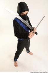 Man Young Athletic Fighting with sword Standing poses Casual Asian
